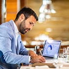 Person writing at desk