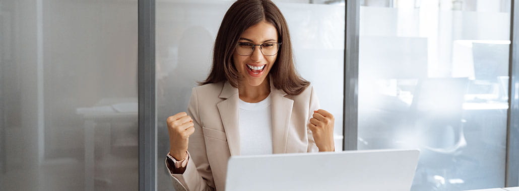 happy person looking at computer
