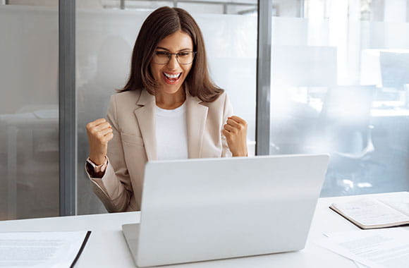 happy person looking at computer