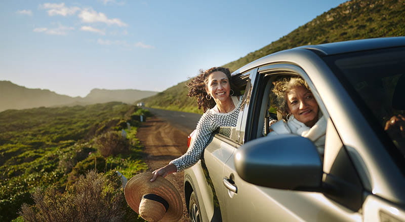 People looking out car windows