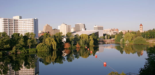 Spokane buildings and riverfront landscape