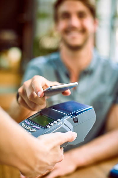 man using his phone to pay