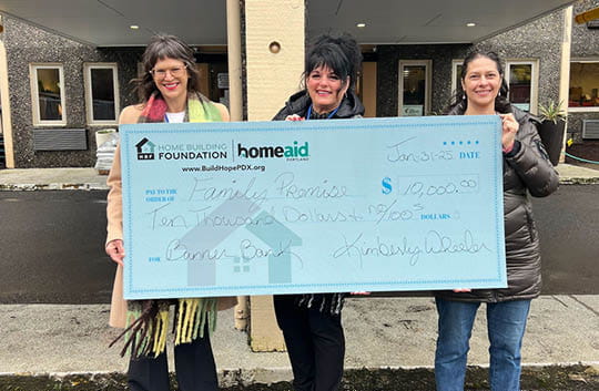 Three women from Family Promise accepting a check from Banner Bank