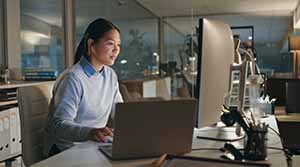 Person looking at computer in an office