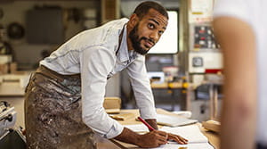 Person in workshop writing