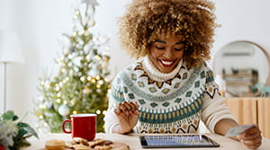 Person looking at tablet in decorated home
