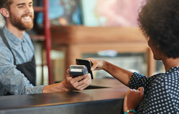 Woman making purchase with mobile device