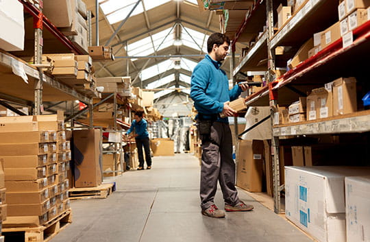 Warehouse worker checking inventory