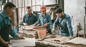 Four family members working in shop