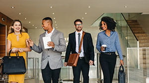 Group of financial professionals walking out of office