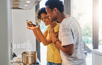 Couple makes dinner together