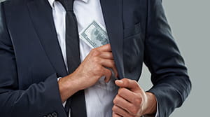 Person pocketing a hundred dollar bill