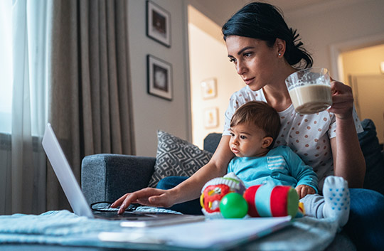 Family working at studying at kitchen table