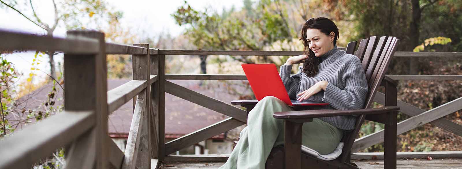 person using laptop outside