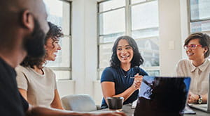 Colleagues in discussion at a conference table