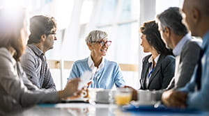 Business people talking at conference table