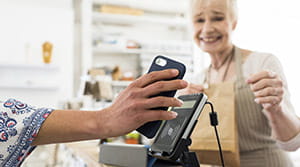 Person using digital wallet on phone to pay at store