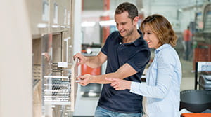 Couple looking at cabinets in store