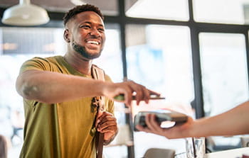 Person using a mobile phone to pay