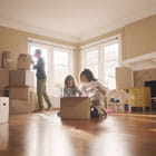 Family unpacks boxes in their new home