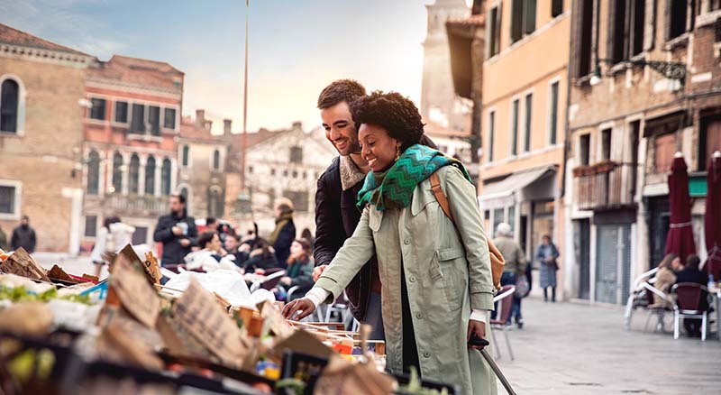 Couple shopping in European market