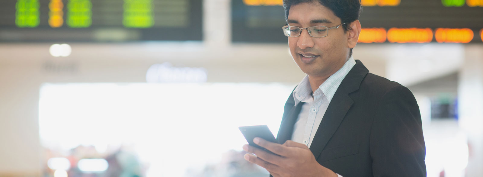 Man accesses bank accounts using Banner Online Banking from his mobile device while traveling