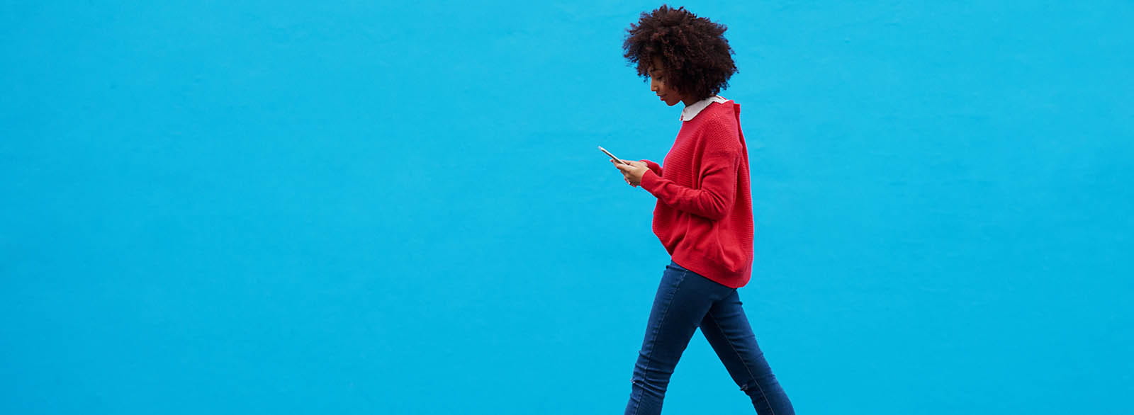 Person using mobile banking while walking