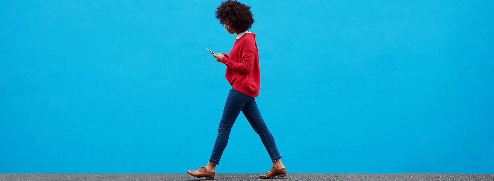 Person using mobile banking while walking