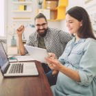 Man and woman looking at a tablet