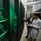 Man and woman review security protocols of a server room