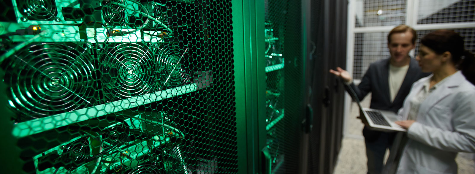 Man and woman review security protocols of a server room