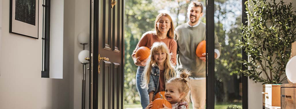 Family bringing pumpkins home