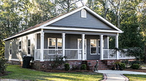 Blue manufactured home and yard