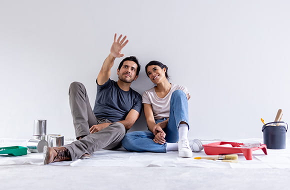 People looking at space in home and pointing