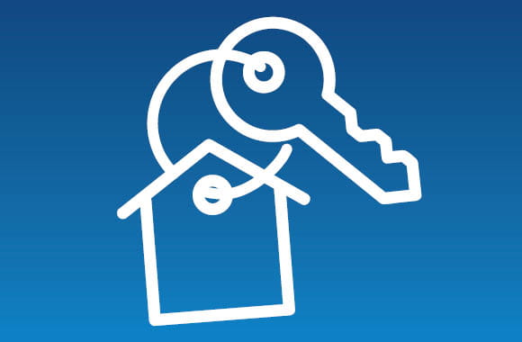 Key icon with house keychain on a blue background