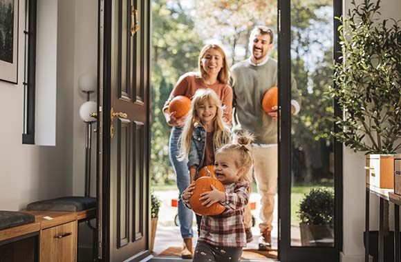 Family bringing pumpkins home