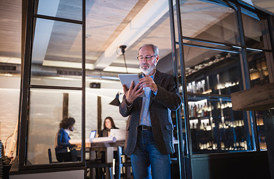 Business owner looking at a tablet