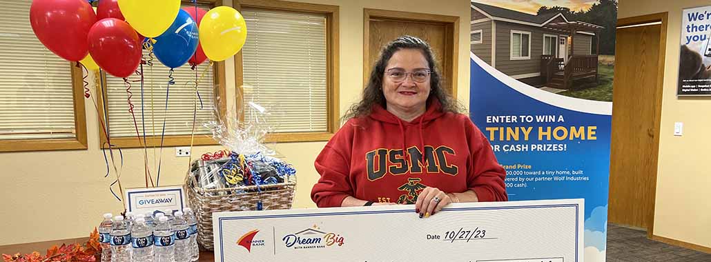 The Dream Big winner with her check at our St. Maries branch
