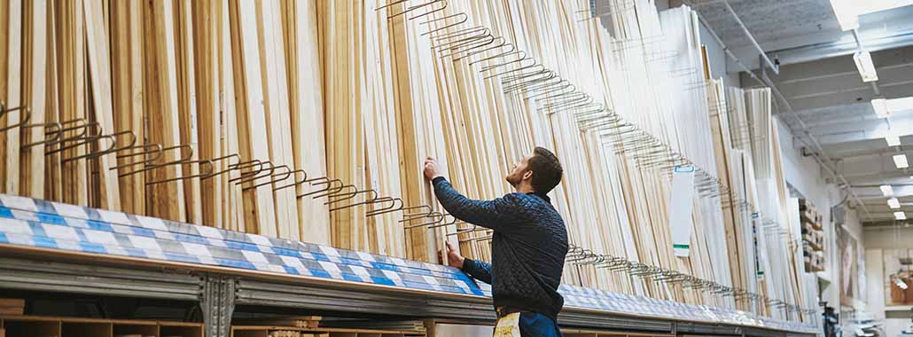 Person looking at wood slats in a store
