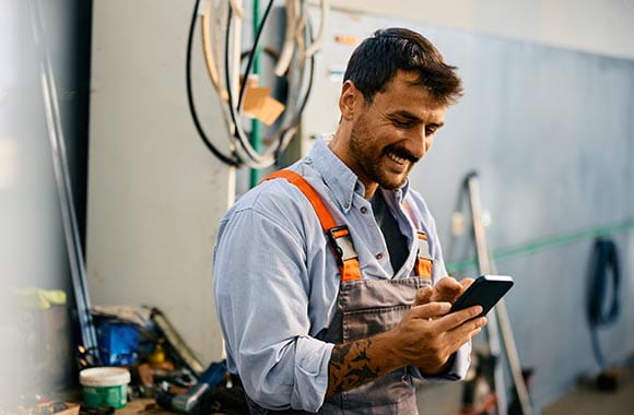 person in shop looking at phone