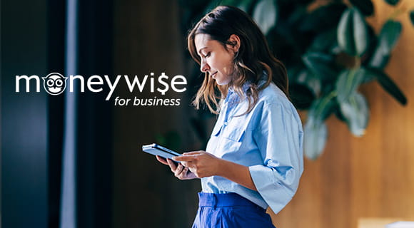 Person on tablet with moneywise for business logo