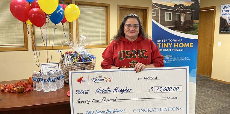 The Dream Big winner with her check at our St. Maries branch