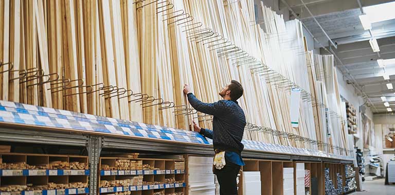 Person looking at wood slats in a store