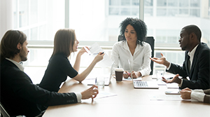 Team members discussing a company policy in a meeting