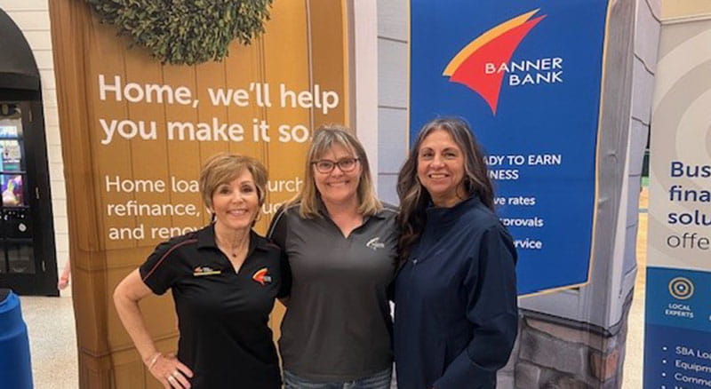 Banner booth and employees at the Coos Bay Homeshow