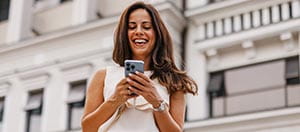 Person on mobile phone smiling