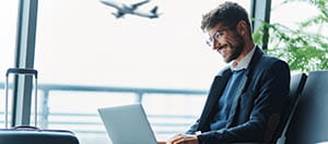 Person using a laptop at an airport