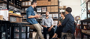 Group of employees talking in warehouse