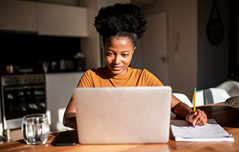 Woman typing on a laptop