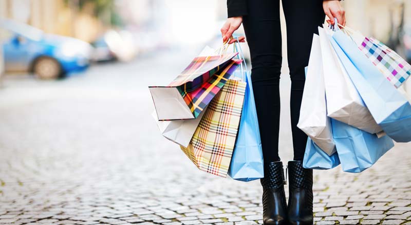 Woman holding multiple shopping bags